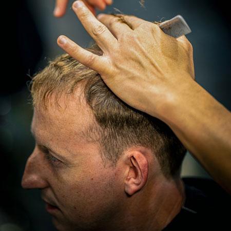 Scissor cut through blond hair